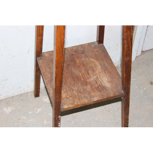 59 - An Art Deco period oak jardinière stand with pie crust type edge