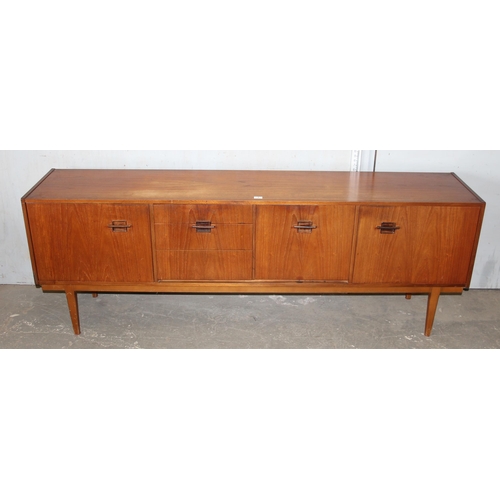 7 - A long retro mid-century Nathan sideboard with 3 drawers and 3 cupboards, approx 214cm wide