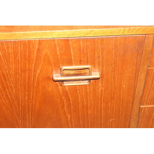 7 - A long retro mid-century Nathan sideboard with 3 drawers and 3 cupboards, approx 214cm wide