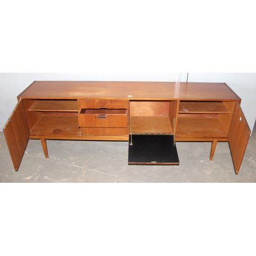 7 - A long retro mid-century Nathan sideboard with 3 drawers and 3 cupboards, approx 214cm wide