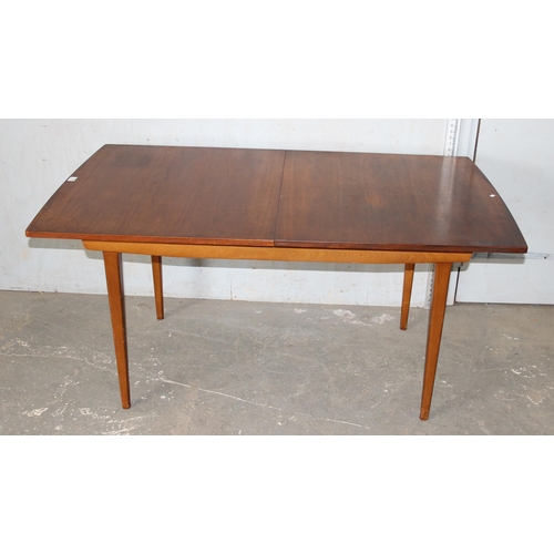 70 - A retro mid-century Nathan extending dining table, approx 154cm extending to 198cm