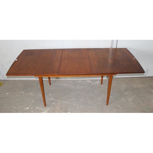 70 - A retro mid-century Nathan extending dining table, approx 154cm extending to 198cm