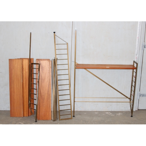 74 - A retro mid-century modular shelving unit believed to be Ladderax but unmarked, 10 shelves with 4 up... 