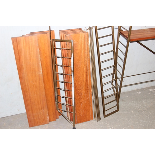 74 - A retro mid-century modular shelving unit believed to be Ladderax but unmarked, 10 shelves with 4 up... 