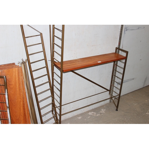 74 - A retro mid-century modular shelving unit believed to be Ladderax but unmarked, 10 shelves with 4 up... 