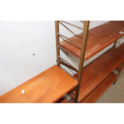 74 - A retro mid-century modular shelving unit believed to be Ladderax but unmarked, 10 shelves with 4 up... 