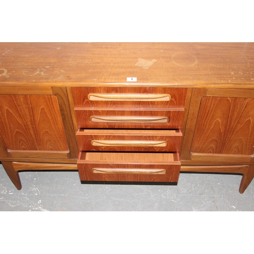 8 - A retro G-Plan teak sideboard with 4 drawers and 4 cupboards, approx 214cm wide