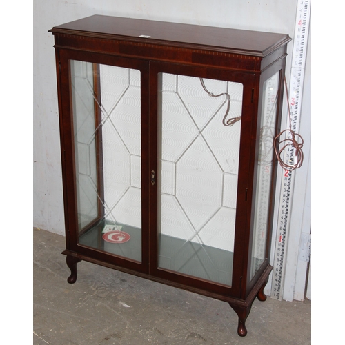 133 - A vintage glazed wooden display cabinet