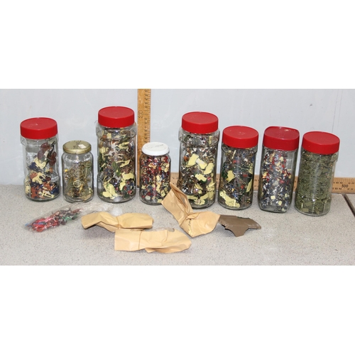 1504 - A large qty of miniature figures in jars, likely Airfix etc