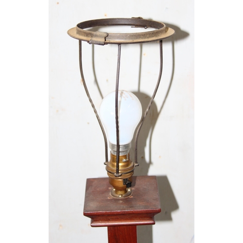 237 - An Art Deco period oak standard lamp