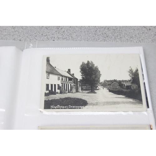 500 - 2 Victorian leather bound photograph albums with musical movements, also containing some photographs