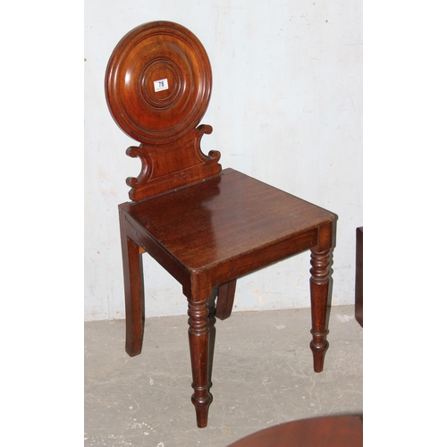 78 - A 19th century mahogany hall chair with circular back