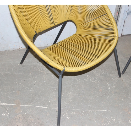 92 - A pair of retro 'Moon' style strung chairs with metal legs