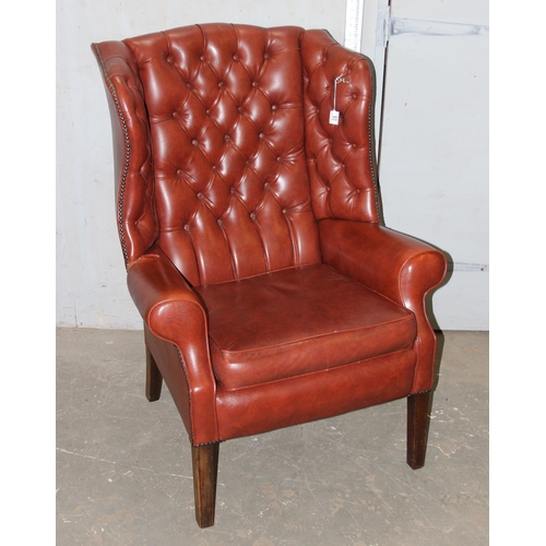 93 - Vintage red leather effect winged backed arm chair