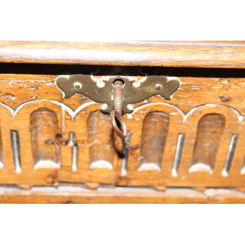 94 - Small antique carved raised coffer with key