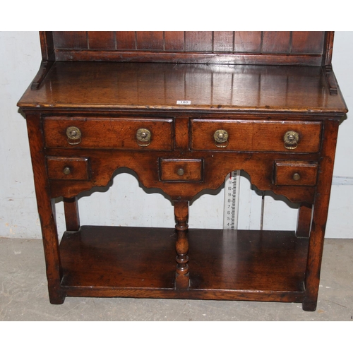 100 - An antique oak cottage dresser of unusually small proportions, likely early 20th century but of 18th... 