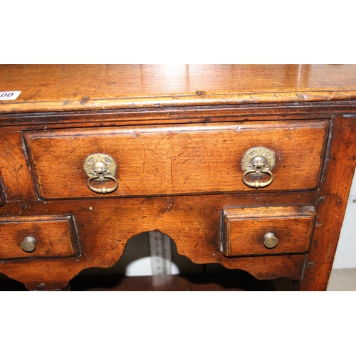 100 - An antique oak cottage dresser of unusually small proportions, likely early 20th century but of 18th... 