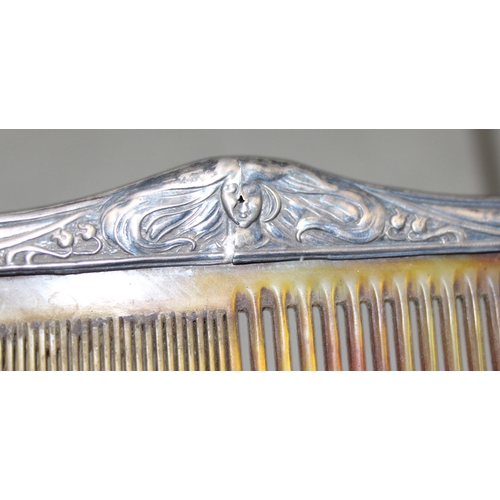 1003 - A silver mounted hand mirror, 2 silver mounted Art Nouveau brushes and a silver mounted comb, Birmin... 