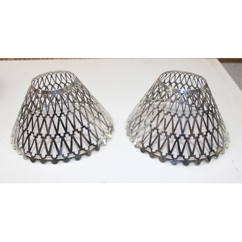 1008 - A pair of silver plated lamp shades, a silver plated matchbox holder/ ashtray, a silver plated mesh ... 