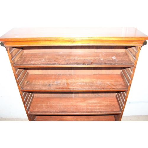 102 - An antique mahogany bookcase with 2 lower drawers and 3 adjustable shelves, approx 97cm wide