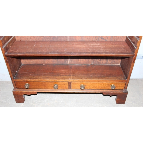 102 - An antique mahogany bookcase with 2 lower drawers and 3 adjustable shelves, approx 97cm wide