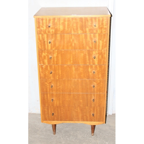 104 - A retro 7 drawer chest of drawers, seemingly unnamed with distinctive metal handles, approx 125cm ta... 