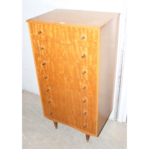 104 - A retro 7 drawer chest of drawers, seemingly unnamed with distinctive metal handles, approx 125cm ta... 