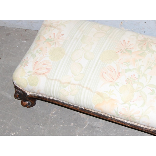 111 - A long low antique mahogany framed footstool, approx 113cm long