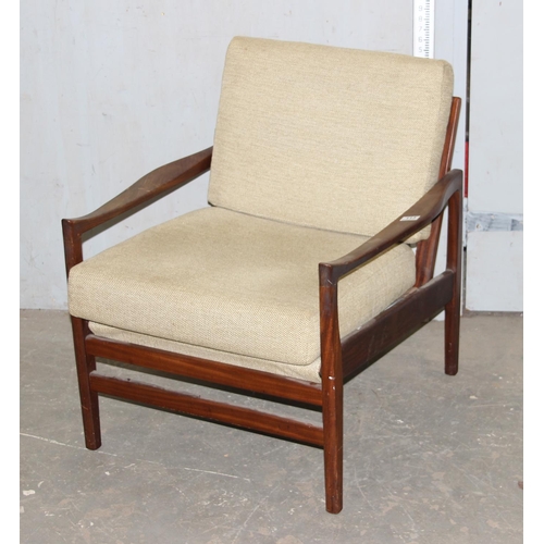 113 - A Scandinavian style retro teak framed armchair with cushions, seemingly unmarked