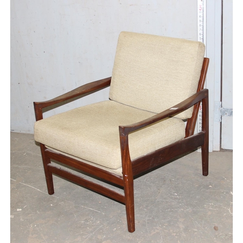 113 - A Scandinavian style retro teak framed armchair with cushions, seemingly unmarked