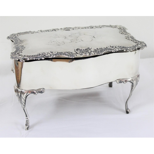 1027 - An impressive large silver jewellery casket with embossed Reynold's Angels decoration and scrolled e... 