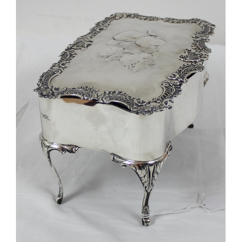 1027 - An impressive large silver jewellery casket with embossed Reynold's Angels decoration and scrolled e... 