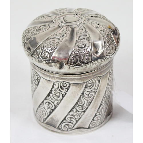 1029 - A silver tea caddy or tobacco pot with swirled design and embossed decoration, Birmingham 1892, make... 