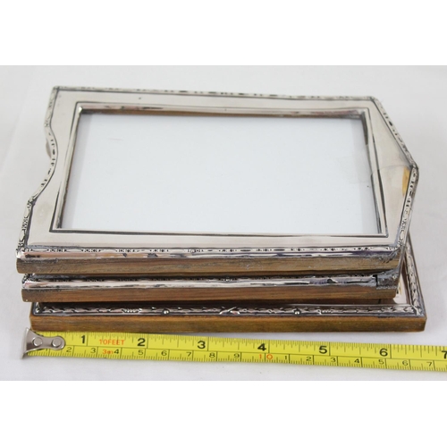 1031 - 3 vintage silver mounted photograph frames, a pair marked for Birmingham 1922 & single marked for Bi... 