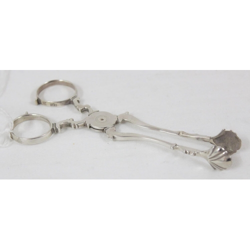 1038 - A pair of silver sugar tongs, likely 18th century, marked IG, no town or date letter