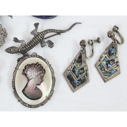 1109 - Qty of assorted silver mounted brooches, earrings, and a ring etc, all marked & XRF tested