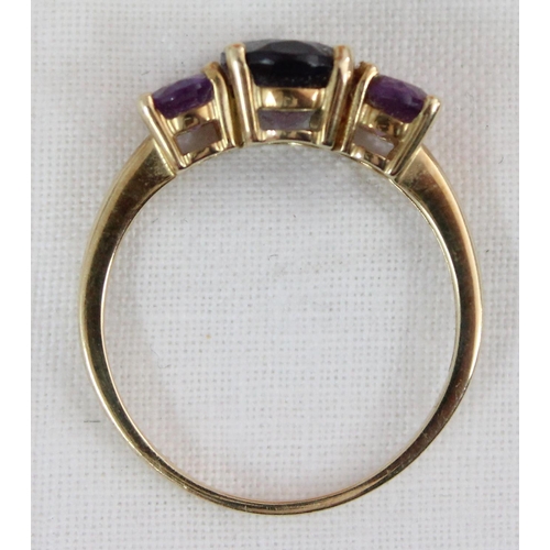 1124 - A 9ct gold ring set with 3 large amethysts, approx size S, approx 2.79g gross