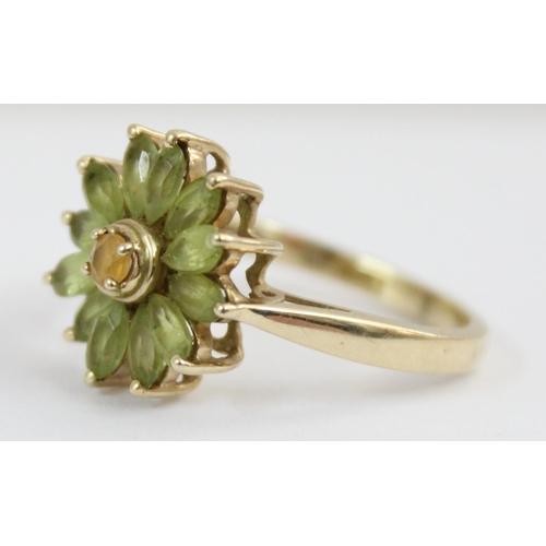 1125 - A 9ct golf floral set stone ring in the form of a daisy, approx size T, approx 4.61g gross