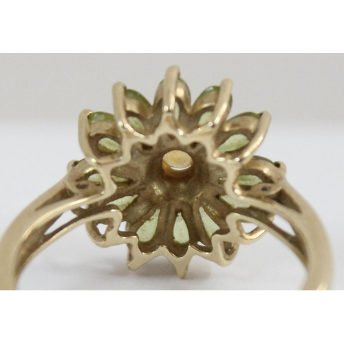 1125 - A 9ct golf floral set stone ring in the form of a daisy, approx size T, approx 4.61g gross