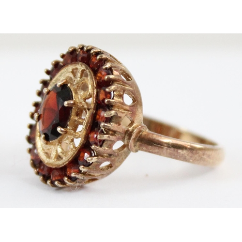 1126 - 9ct gold ring with a retro garnet setting, approx size P, approx 4.96g gross