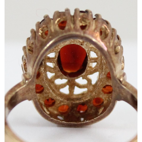 1126 - 9ct gold ring with a retro garnet setting, approx size P, approx 4.96g gross