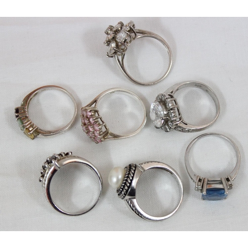 1132 - 7 assorted silver dress rings with stones, all approx size T