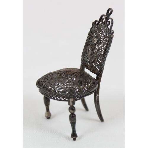 1136 - A small silver filigree model of a chair, a 925 silver pin cushion formed as a pig, 2 Italian micro ... 