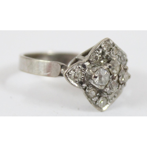 1146 - 18ct white gold and diamond set ring formed as a strap and button, shank marked 18ct and XRF confirm... 