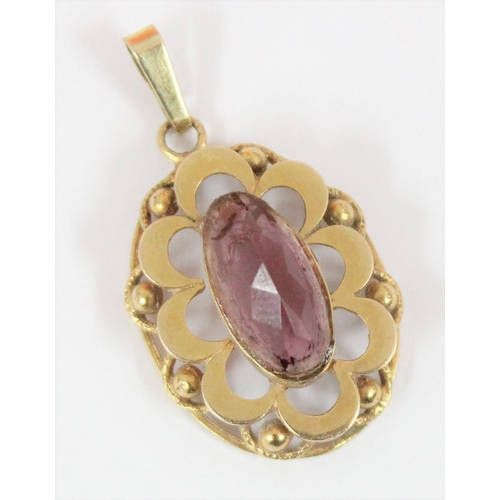 1147 - A 9ct gold mounted pendant set with purple stone, hallmarks indistinct but XRF tested as 9ct gold, a... 