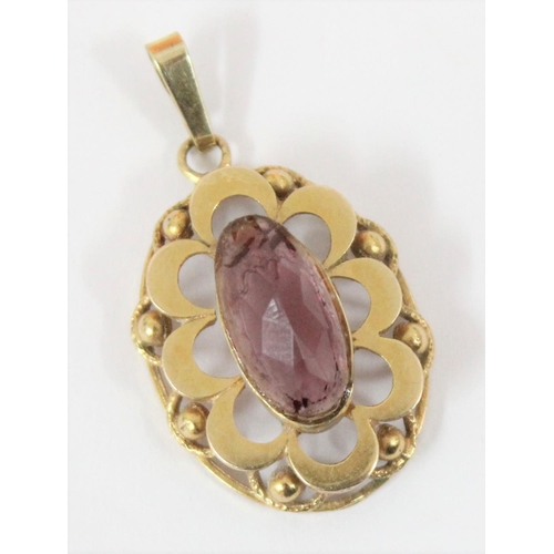 1147 - A 9ct gold mounted pendant set with purple stone, hallmarks indistinct but XRF tested as 9ct gold, a... 