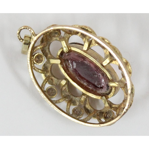 1147 - A 9ct gold mounted pendant set with purple stone, hallmarks indistinct but XRF tested as 9ct gold, a... 