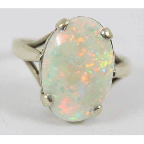 1148 - A 9ct gold and opal set ring, marks rubbed but XRF confirmed as 9ct gold, approx size N, approx 3.32... 