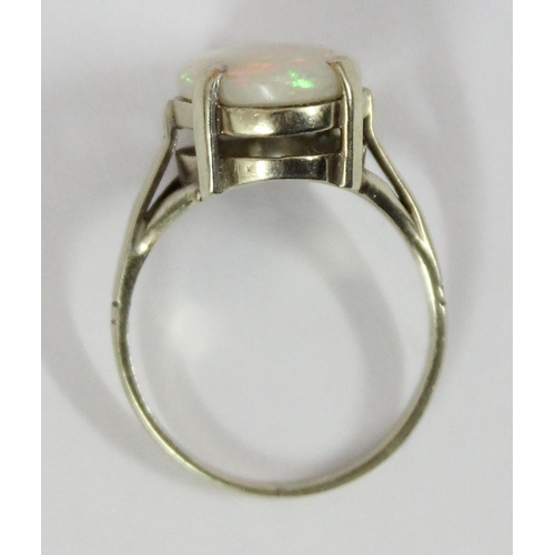 1148 - A 9ct gold and opal set ring, marks rubbed but XRF confirmed as 9ct gold, approx size N, approx 3.32... 