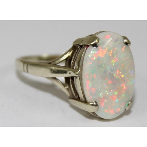 1148 - A 9ct gold and opal set ring, marks rubbed but XRF confirmed as 9ct gold, approx size N, approx 3.32... 